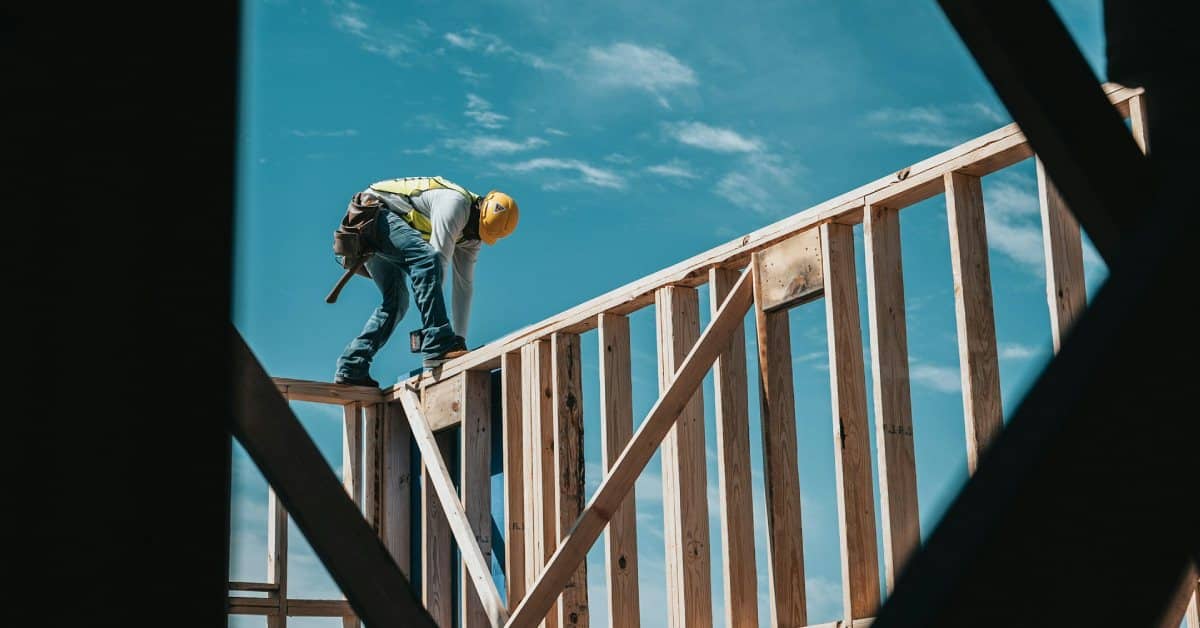 a construction worker building a house